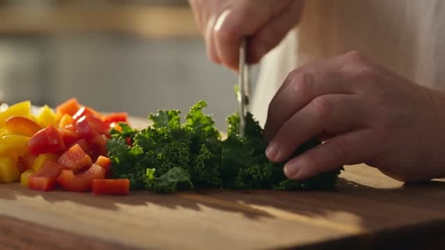 Salad being prepared in a kitchen