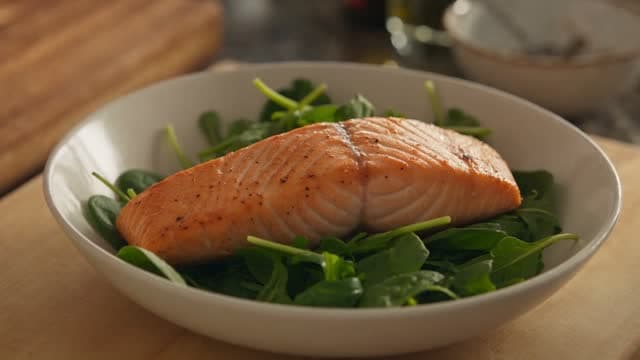 A salmon bowl being plated